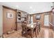 Hardwood dining room features a large table and ample cabinetry for storage at 7025 Chimney Rock Ct, Indianapolis, IN 46217