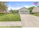Charming home with a two-car garage, well-manicured lawn, tasteful landscaping, and inviting curb appeal at 7025 Chimney Rock Ct, Indianapolis, IN 46217