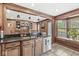 The kitchen features granite countertops and a convenient breakfast bar with natural light at 7025 Chimney Rock Ct, Indianapolis, IN 46217