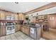 Open kitchen features granite countertops, stainless appliances, and seamless flow to dining area at 7025 Chimney Rock Ct, Indianapolis, IN 46217