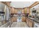 Spacious kitchen with stainless appliances, granite countertops, and ample cabinet space at 7025 Chimney Rock Ct, Indianapolis, IN 46217