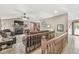 Cozy living room with fireplace, plush seating, and open access to the dining area at 7025 Chimney Rock Ct, Indianapolis, IN 46217