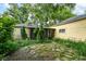 The backyard with a stone patio and screened in porch at 713 W Cromer Ave, Muncie, IN 47303