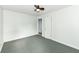 Green bedroom featuring one window, ceiling fan, and a closet at 713 W Cromer Ave, Muncie, IN 47303