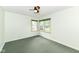 Cozy bedroom featuring two large windows and ceiling fan at 713 W Cromer Ave, Muncie, IN 47303
