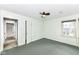 A bright bedroom features a ceiling fan and natural light from a window at 713 W Cromer Ave, Muncie, IN 47303
