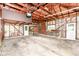 Unfinished garage features an overhead door and exposed rafters at 713 W Cromer Ave, Muncie, IN 47303