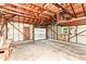 Spacious unfinished garage with an overhead garage door at 713 W Cromer Ave, Muncie, IN 47303