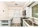 Charming kitchen with updated countertops, subway tile backsplash, and modern stainless steel appliances at 713 W Cromer Ave, Muncie, IN 47303