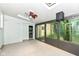 Relaxing sunroom with sliding glass windows, ceiling fan, and natural light at 713 W Cromer Ave, Muncie, IN 47303