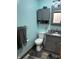 Bathroom featuring grey vanity with granite counter, grey walls, and a toilet at 719 Henry St, Lebanon, IN 46052