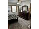 A bedroom featuring a decorative ceiling fan, dresser, and two windows for natural light at 719 Henry St, Lebanon, IN 46052