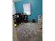 Practical bedroom with teal walls and neutral carpet at 719 Henry St, Lebanon, IN 46052