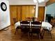 Traditional dining room with hardwood floors, floral centerpiece, and classic furniture at 719 Henry St, Lebanon, IN 46052