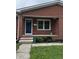 Close up of the front door and porch on a red brick house at 719 Henry St, Lebanon, IN 46052