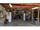 Spacious garage with wood beams and plenty of storage space at 719 Henry St, Lebanon, IN 46052