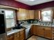 Kitchen featuring stainless steel appliances, wooden cabinets and window views at 719 Henry St, Lebanon, IN 46052