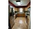 Well-lit kitchen with stainless steel appliances and light wood cabinets at 719 Henry St, Lebanon, IN 46052