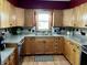 Updated kitchen featuring modern stainless steel appliances and wood cabinets at 719 Henry St, Lebanon, IN 46052