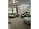 Inviting living room with a large window, plush sofas, and a comfortable recliner at 719 Henry St, Lebanon, IN 46052