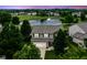An aerial view of a beautiful home in a peaceful neighborhood, complete with a scenic pond and mature trees at 7214 Morello Ln, Noblesville, IN 46062