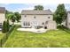 Spacious backyard with a patio, fire pit, shed and a black chain link fence, perfect for outdoor enjoyment at 7214 Morello Ln, Noblesville, IN 46062