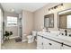 Bathroom with double vanity, tile floor, and glass shower at 7214 Morello Ln, Noblesville, IN 46062