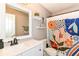 Bright bathroom with quartz countertop vanity, modern mirror, and colorful shower curtain at 7214 Morello Ln, Noblesville, IN 46062