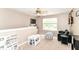 Cozy bonus room with plush carpet, lots of natural light, and fun furniture to be enjoyed by all at 7214 Morello Ln, Noblesville, IN 46062