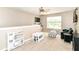 Cozy bonus room with plush carpet, lots of natural light, and fun furniture to be enjoyed by all at 7214 Morello Ln, Noblesville, IN 46062