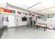 Spacious garage featuring an epoxy floor, TV, extra storage, and fun for the whole Gathering at 7214 Morello Ln, Noblesville, IN 46062