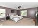 Main bedroom featuring neutral carpet, bed with white comforter, and ceiling fan at 7214 Morello Ln, Noblesville, IN 46062