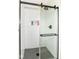 Stylish walk-in shower with white subway tile and black hardware at 7214 Morello Ln, Noblesville, IN 46062
