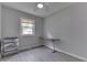 Clean and functional bedroom offering a window for natural light and ample space for study or relaxation at 724 Alexander St, Greenwood, IN 46143