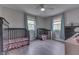 Spacious bedroom designed with two windows for ample natural light, and two large dressers at 724 Alexander St, Greenwood, IN 46143