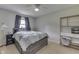 Comfortable bedroom showcasing a platform bed, a window for natural light, and shelving for added storage at 724 Alexander St, Greenwood, IN 46143