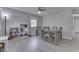 Neutral dining area features a modern light fixture, bookshelf, and a table with seating for six at 724 Alexander St, Greenwood, IN 46143