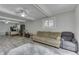 Open living area with a comfy sofa, a desk area, and room for recreation at 724 Alexander St, Greenwood, IN 46143