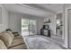 Cozy living room with a sliding glass door leading to the outside and neutral interior at 724 Alexander St, Greenwood, IN 46143