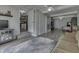 Inviting living room featuring neutral colors, a ceiling fan, and an open entryway to the adjacent kitchen at 724 Alexander St, Greenwood, IN 46143