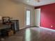 A bedroom with a door to the outside and a red accent wall at 75 Byram Blvd, Martinsville, IN 46151