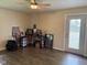 A simple bedroom with a door to the outside and hardwood floors at 75 Byram Blvd, Martinsville, IN 46151