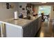 Close-up of the kitchen island featuring modern countertops, storage, and a convenient sink at 75 Byram Blvd, Martinsville, IN 46151