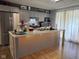 Modern kitchen featuring gray cabinets, stainless steel appliances, and a large island with seating at 75 Byram Blvd, Martinsville, IN 46151