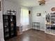 A cozy living room with warm hardwood floors and a large shelving unit at 75 Byram Blvd, Martinsville, IN 46151
