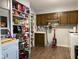 Well-stocked pantry with custom shelving and storage solutions, plus laundry area at 75 Byram Blvd, Martinsville, IN 46151