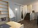 Bright storage room with sliding mirror door, wooden shelving, and staircase, ideal for organization and accessibility to other areas at 75 Byram Blvd, Martinsville, IN 46151