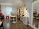 Spacious storage room with ample shelving, work table, red fireplace, and bright window, ideal for organized workspace at 75 Byram Blvd, Martinsville, IN 46151