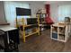 Well-organized storage room featuring shelving units, work tables, and ample space for various storage containers and a red accent fireplace at 75 Byram Blvd, Martinsville, IN 46151