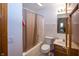 Neutral bathroom with a shower-tub combo and wood vanity with tile backsplash at 7632 Sea Crest N Way, Noblesville, IN 46062